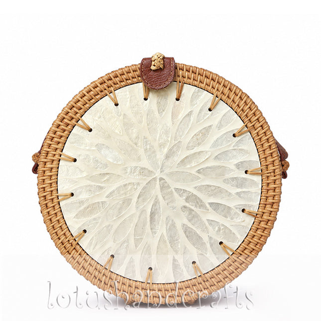 Cute handmade round rattan crossbody bag featuring a pearl flower mother of pearl inlay.