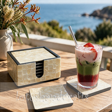 Complete with a matching square holder, these seashell mosaic coasters bring elegance and organization to everyday table settings.