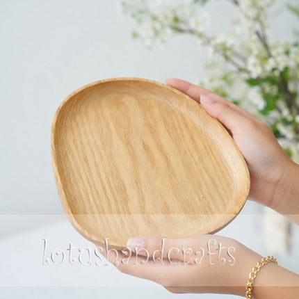 Ashwood pebble shaped serving tray with durable craftsmanship for beautiful and long lasting everyday use.