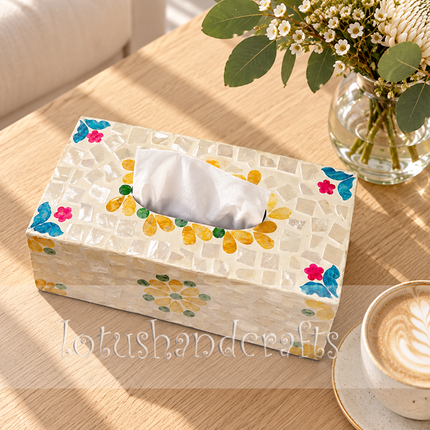 Beautiful blue and purple floral mosaic tissue box styled on a living room coffee table, adding a sophisticated coastal touch to home decor.