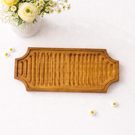 Large handcrafted ribbed wooden serving board tray made from durable natural redwood for elegant and practical everyday use.