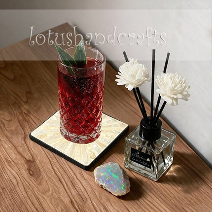 A thoughtful housewarming gift featuring luminous shell inlay, an elegant sunburst motif, and a practical matching holder.