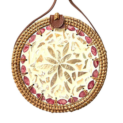 Cute lovely round rattan crossbody bag with inlaid mother of pearl.