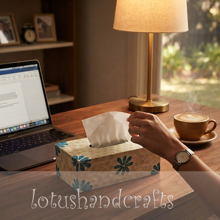A stylish mother-of-pearl tissue holder enhancing a modern living space aesthetic.