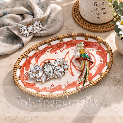 Organic red wave-like strokes surround the fish, enhancing the tray’s artistic coastal charm.