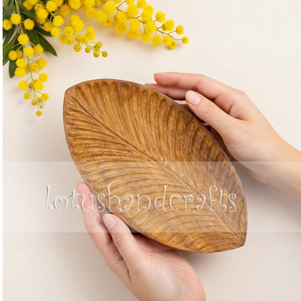 Handcarved redwood leaf serving platter with durable natural wood craftsmanship for elegant everyday use. 