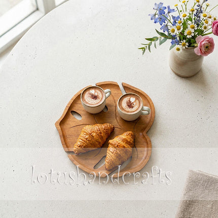 Cute redwood Monstera serving tray brings a natural and charming touch to your kitchen.