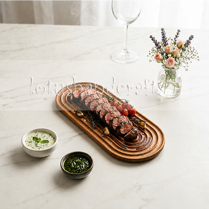 Small Ripple Oval Redwood Serving Tray with a smooth natural finish that is easy to clean.