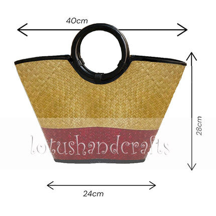 Handwoven seagrass tote bag with a round black handle.