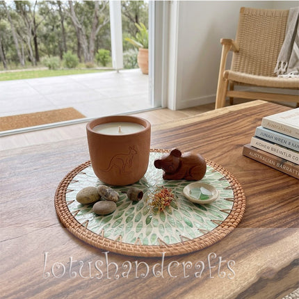 Handmade rattan placemat with shimmering green mother of pearl leaf inlay.