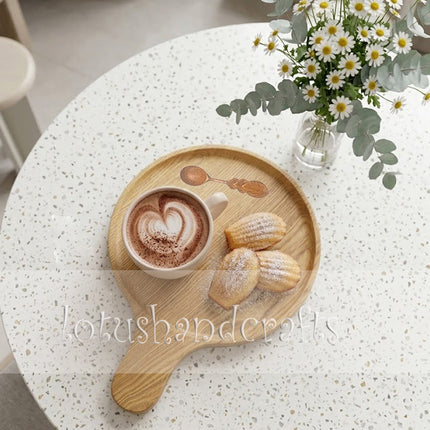 Round ashwood serving tray with handle, perfect for coffee setups and easy to clean.