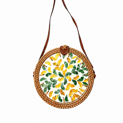 Cute rattan crossbody bag with green and yellow mother-of-pearl leaf inlay.