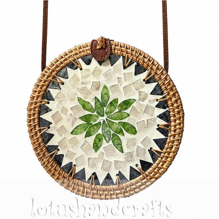 Cute round rattan crossbody bag with green leaf and pearl mosaic inlay.