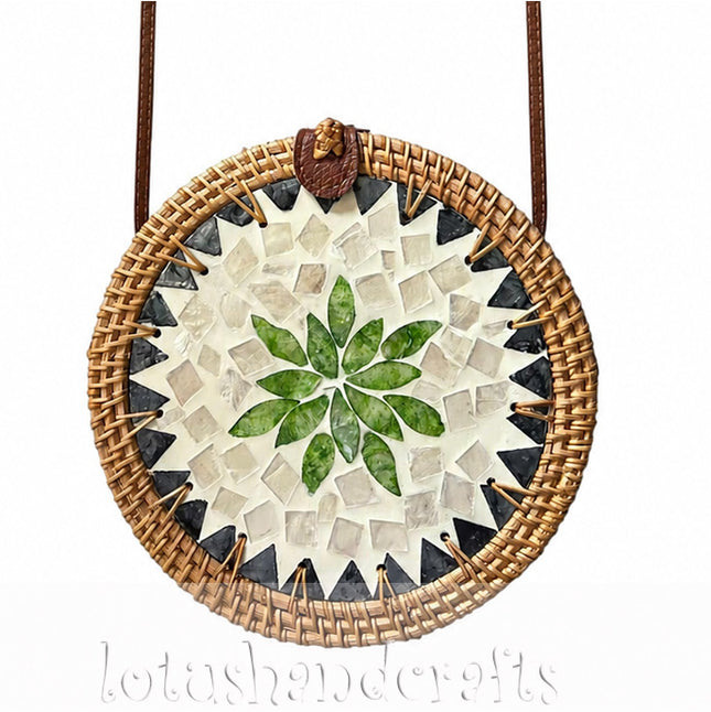 Cute round rattan crossbody bag with green leaf and pearl mosaic inlay.
