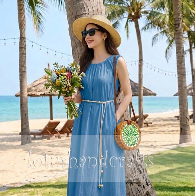 Elegant boho round rattan crossbody bag with green leaf mother of pearl inlay.