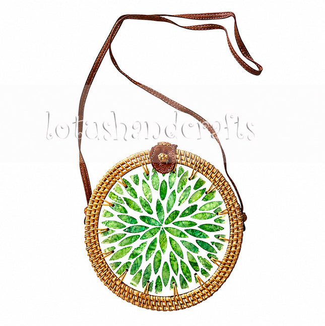 Cute handwoven round rattan crossbody bag with green leaf mother of pearl inlay.