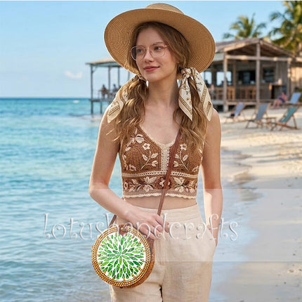 Boho round rattan crossbody bag with green leaf mother of pearl inlay that stands out beautifully.