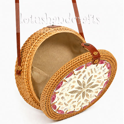 Lovely round rattan crossbody bag with inlaid mother of pearl for a luxurious.