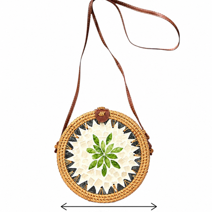 This round rattan crossbody bag with mother of pearl leaf mosaic and leather strap is the perfect size.