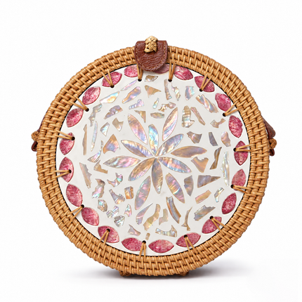 Cute round rattan crossbody bag featuring pink petal mother of pearl inlay accents.