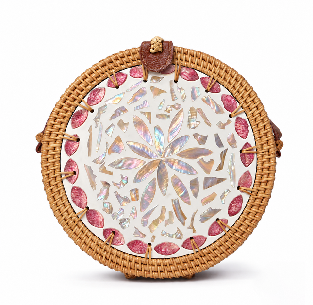 Cute round rattan crossbody bag featuring pink petal mother of pearl inlay accents.