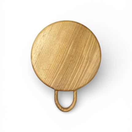 Cute round wood cutting board with a loop handle for easy serving and display.