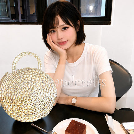 Round Woven Water Hyacinth Handbag with Faux Pearl Top Handle.