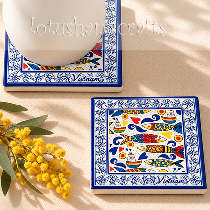 Charming nautical ceramic coaster featuring colourful sailboats, playful hearts, curling ocean waves, and detailed fish illustrations.