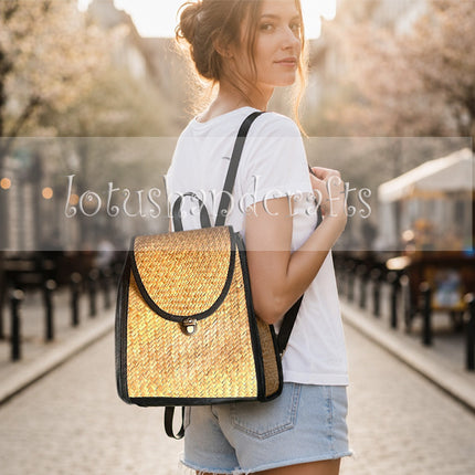 Handwoven seagrass backpack in a boho style with side zipper pockets.