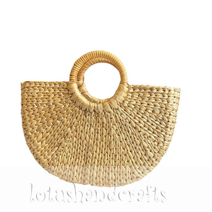 Handwoven half moon seagrass tote bag with cute round handles.