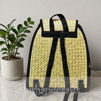Handwoven seagrass backpack with side zipper pockets.