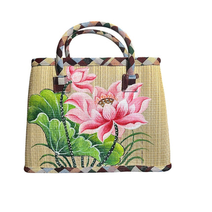 Handmade woven seagrass tote bag with an elegant hand-painted lotus design.