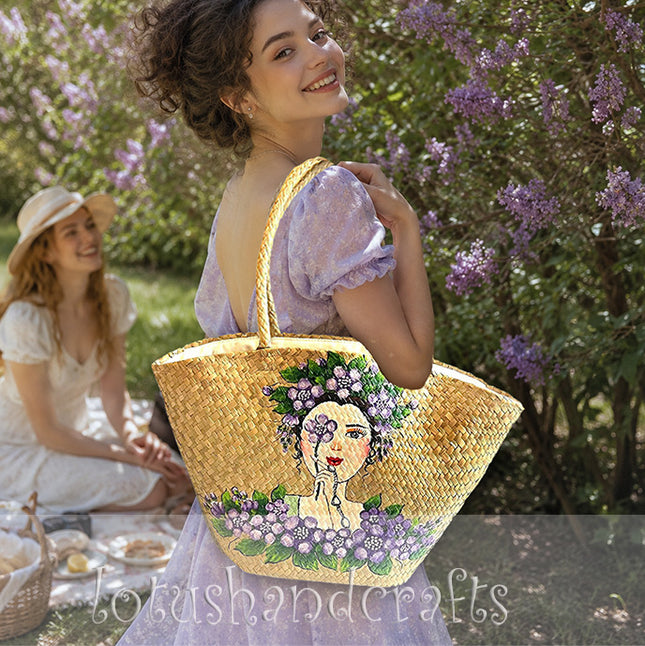 Handwoven seagrass tote bag with elegant hand painted floral lady artwork.