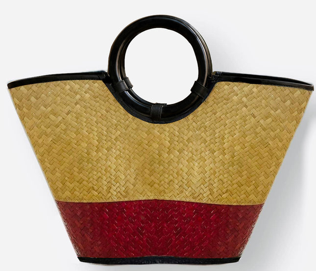 Handwoven seagrass tote bag with round black handle in crimson red.