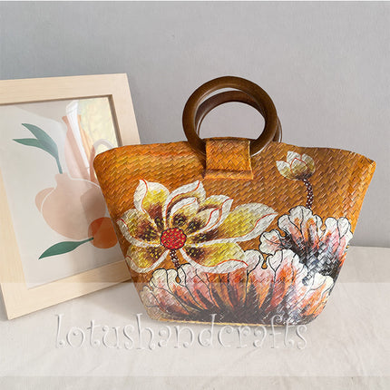 Handwoven seagrass tote bag with elegant hand painted blooming flowers.