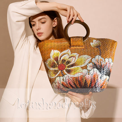 Handwoven seagrass tote bag with elegant hand painted blooming floral artwork.