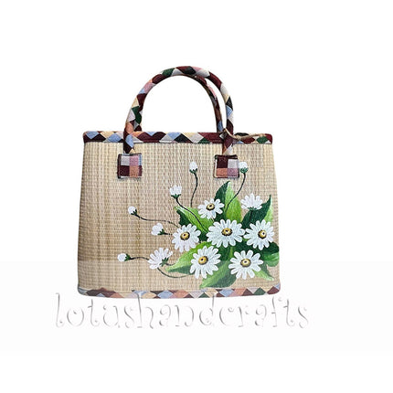 Cute handwoven seagrass tote bag with a hand painted white daisy bouquet.