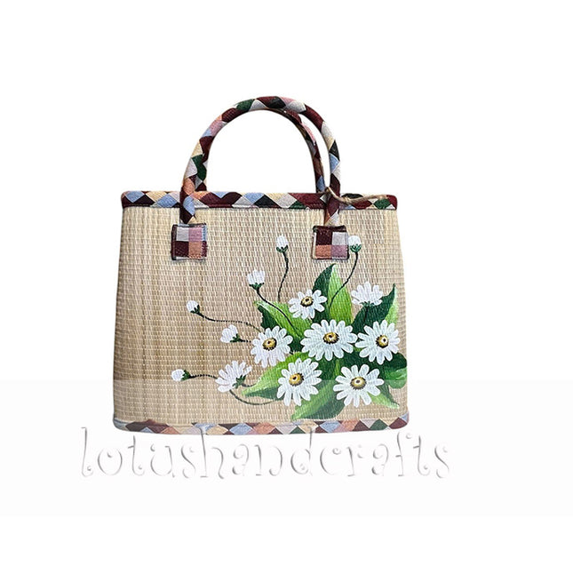 Cute handwoven seagrass tote bag with a hand painted white daisy bouquet.