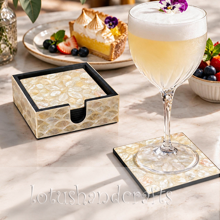 The contrasting dark edges frame the luminous shell pattern, enhancing the square silhouette and refined appearance of each coaster.