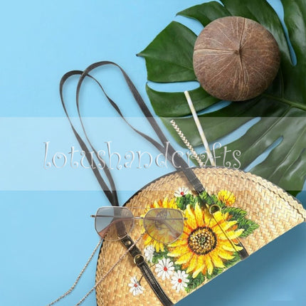 The woven grass half moon with sunflowers creates a youthful and striking everyday fashion style.