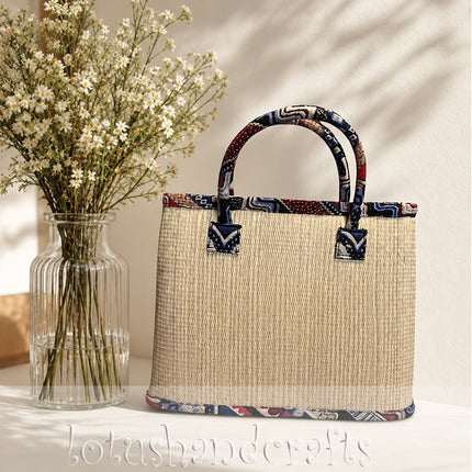Handmade woven seagrass tote bag with a unique snowy Christmas village painting.