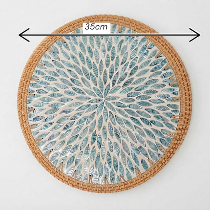 size mother of pearl charger plate featuring a striking turquoise sunburst leaf pattern.