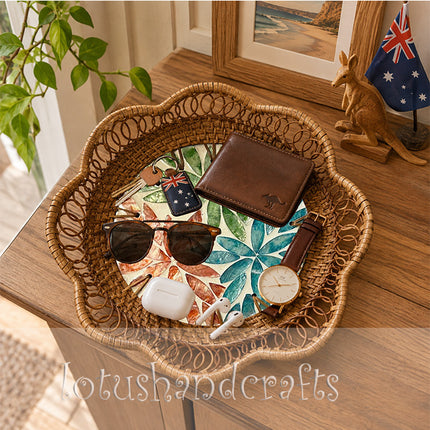 Handwoven rattan tray featuring a modern twelve petal botanical rosette.