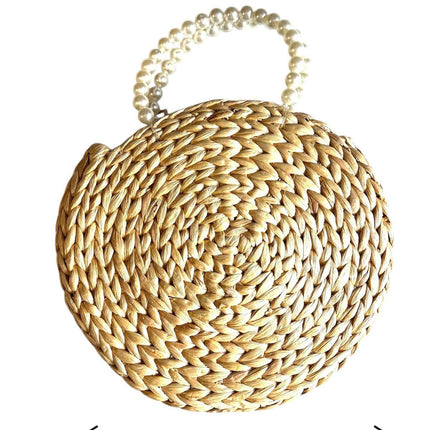 Handwoven round water hyacinth handbag with faux pearl handle for a youthful look.