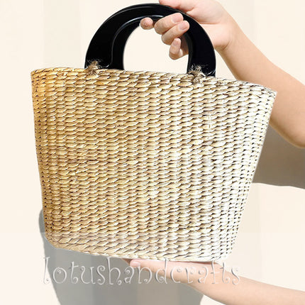 Cute handwoven water hyacinth straw top handle handbag.