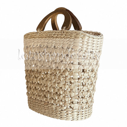 Handwoven water hyacinth open weave handbag with wooden top handle for a youthful look.