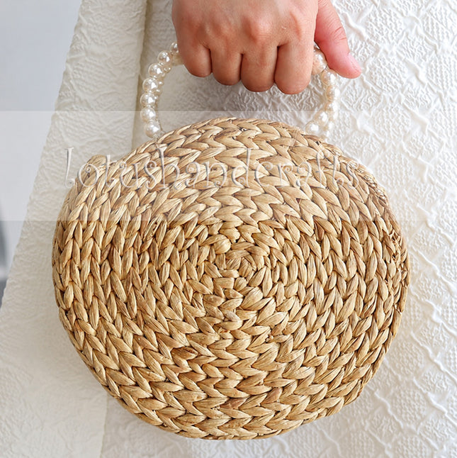 Round Woven Water Hyacinth Handbag with Faux Pearl Top Handle.