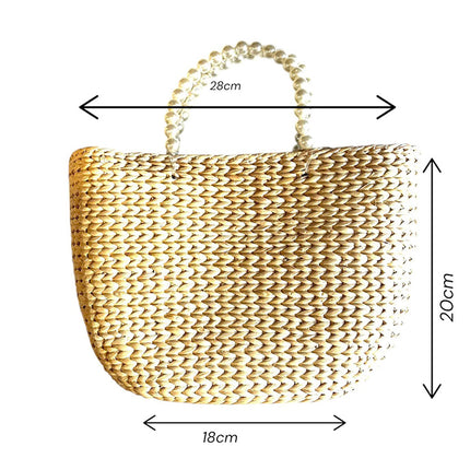 Handwoven water hyacinth tote bag with pearl handles, 28 × 20 cm.