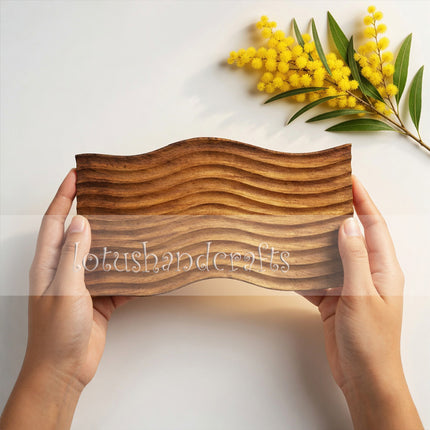 Handcrafted wave carved wooden serving board made from natural wood for elegant everyday serving and décor.