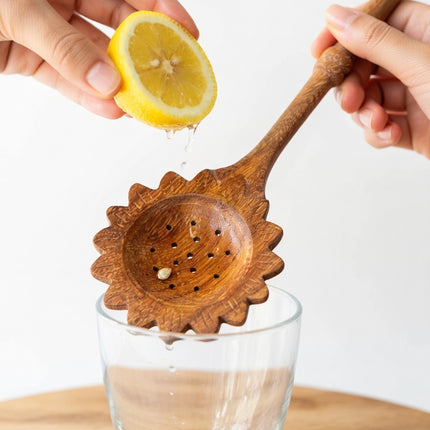 Sunflower slotted wooden spoon easy to clean durable elegant perfect for everyday cooking and serving.